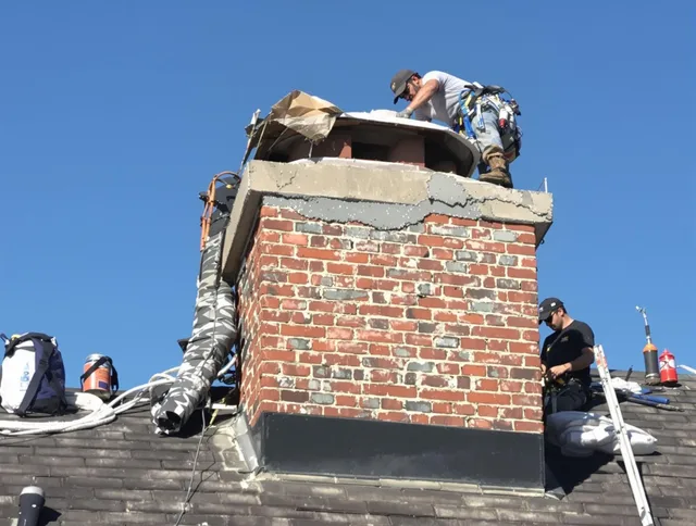 East Windsor Chimney Sweep installing a custom chimney crown in East Windsor, CT