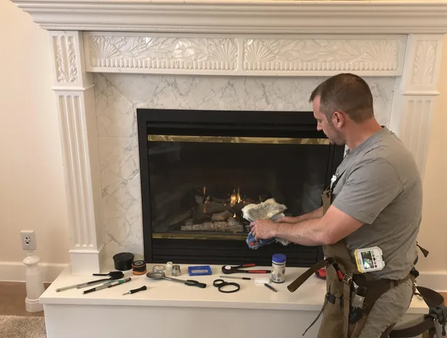 East Windsor Chimney Sweep performing fireplace maintenance in East Windsor, CT