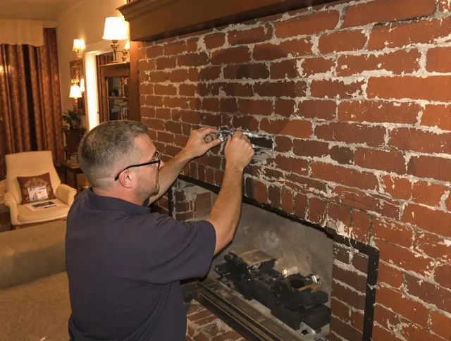 East Windsor Chimney Sweep expert fixing a fireplace in East Windsor, CT